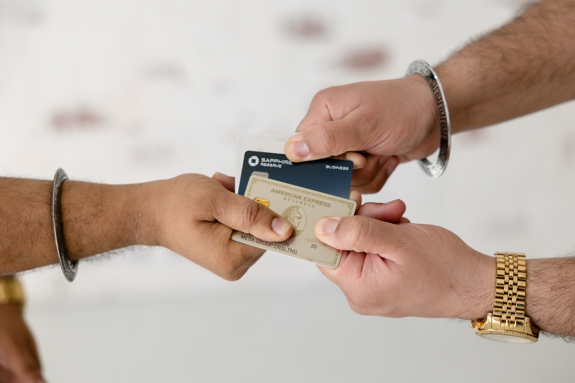 Closeup of American Express and Chase Sapphire Reserve business credit cards held by Mesa Group Consulting advisors